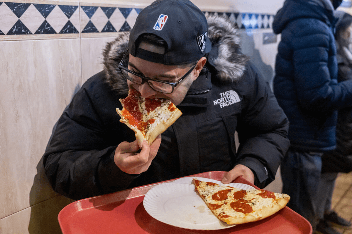 person eating pizza