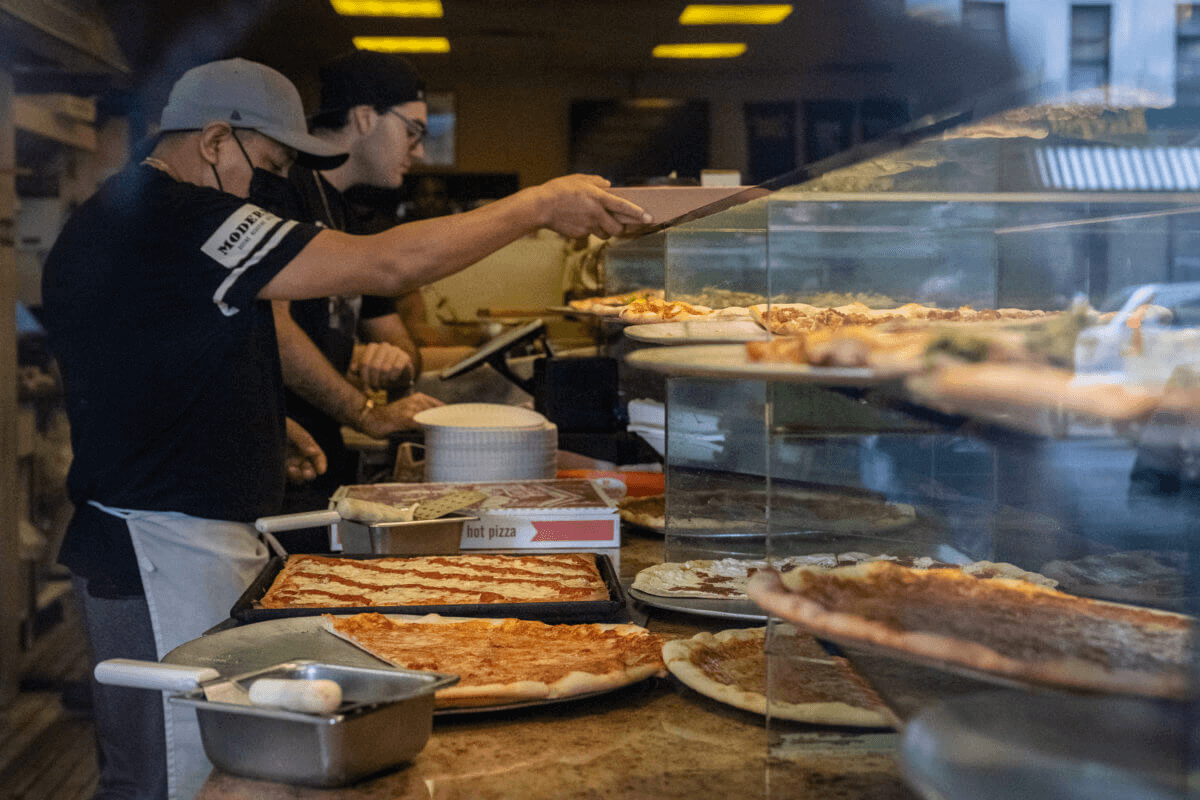  lenny's pizza workers serving pizza