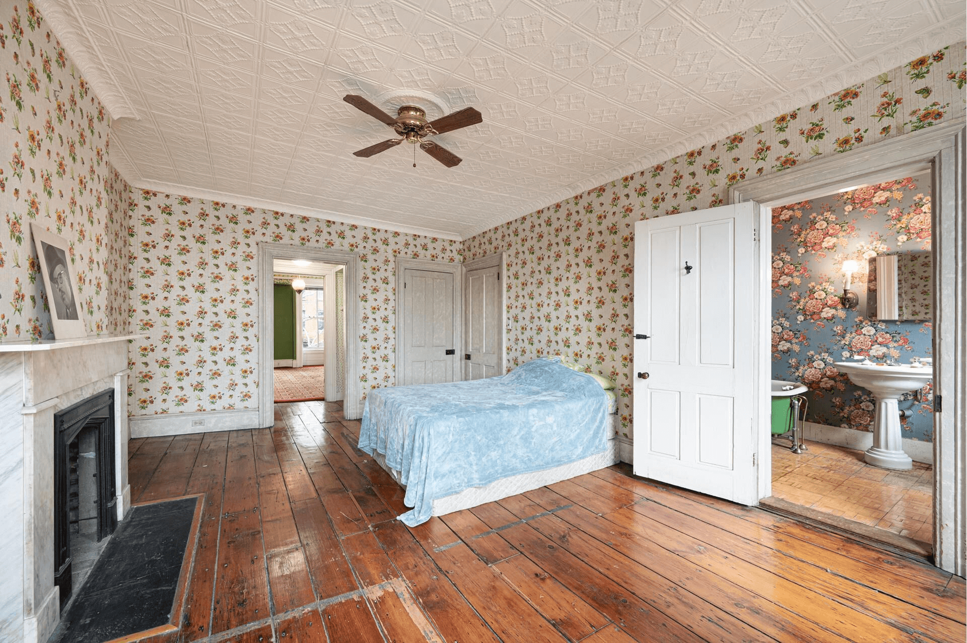 bedroom with marble mantel