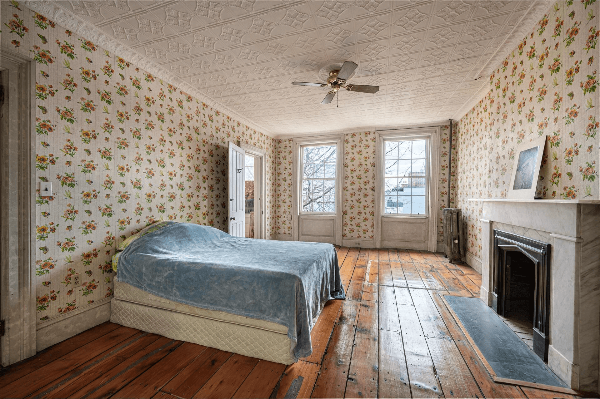 bedroom with marble mantel