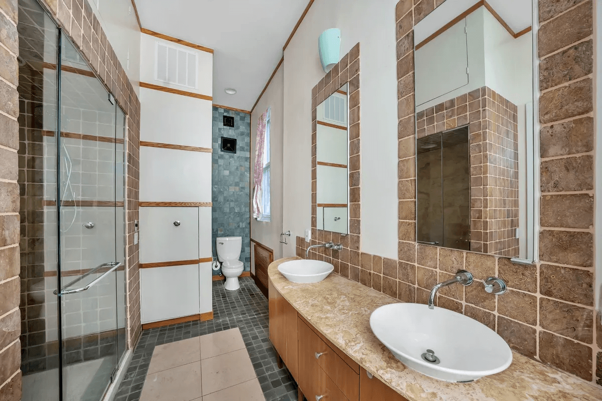bathroom with vessel sinks
