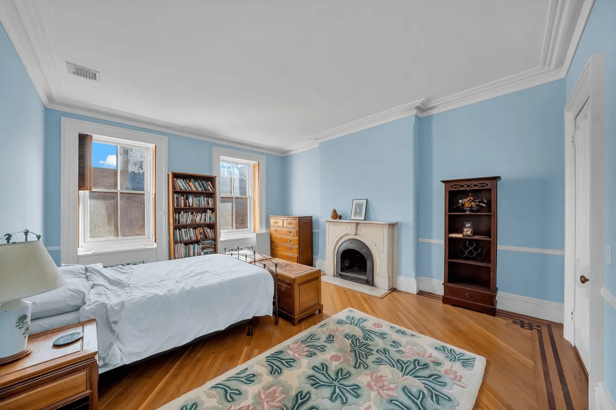 bedroom with marble mantel