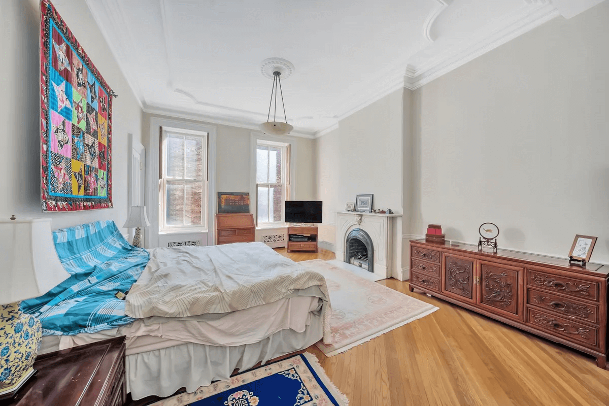 bedroom with marble mantel