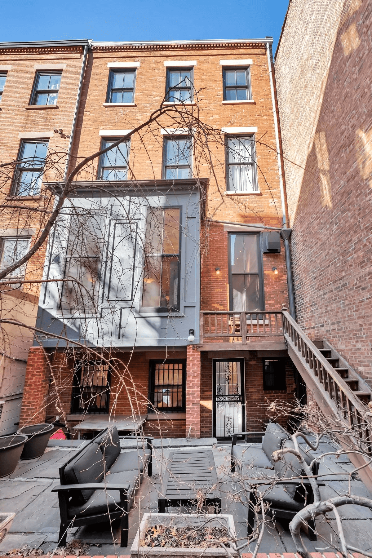 rear of the house with view of the stone patio