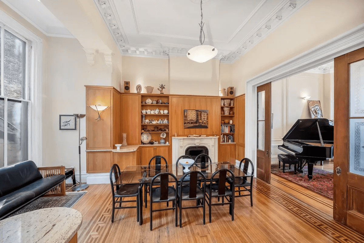 dining area with cabinets around mantel