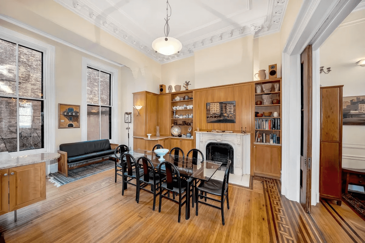 dining area with cabinets around mantel