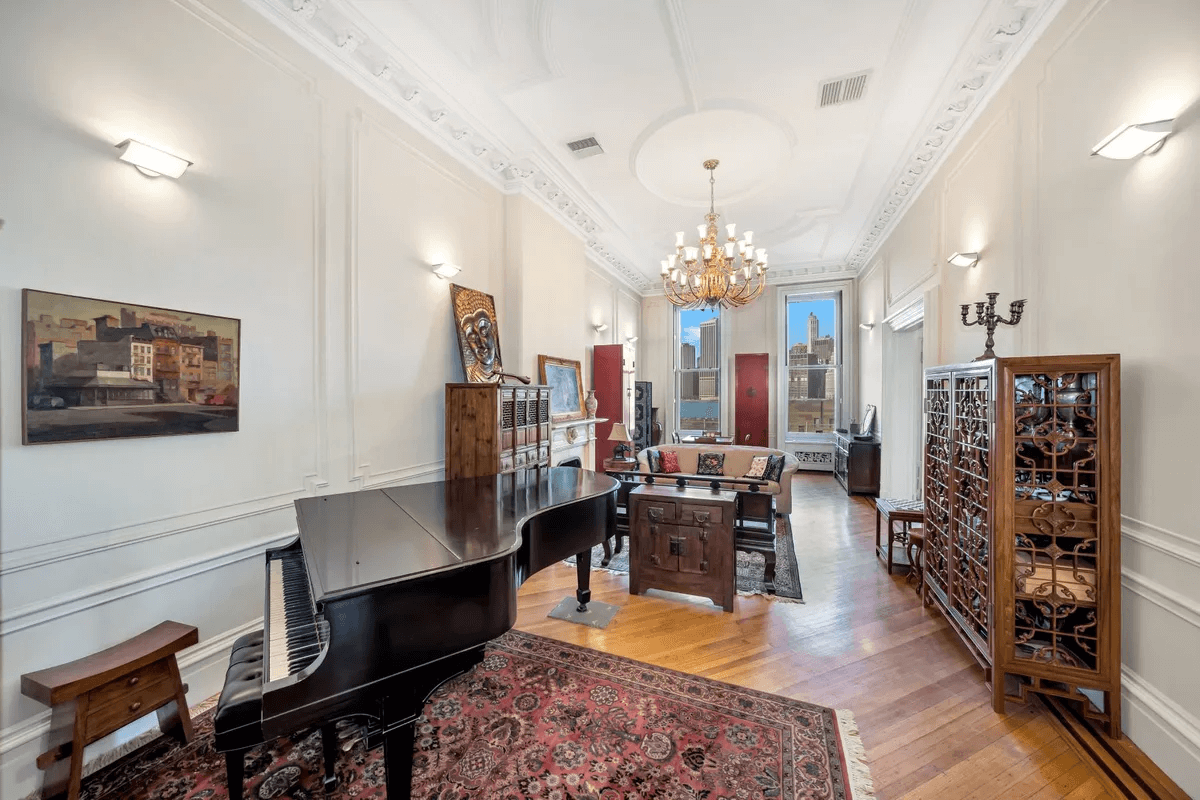 parlor with plasterwork and marble mantel