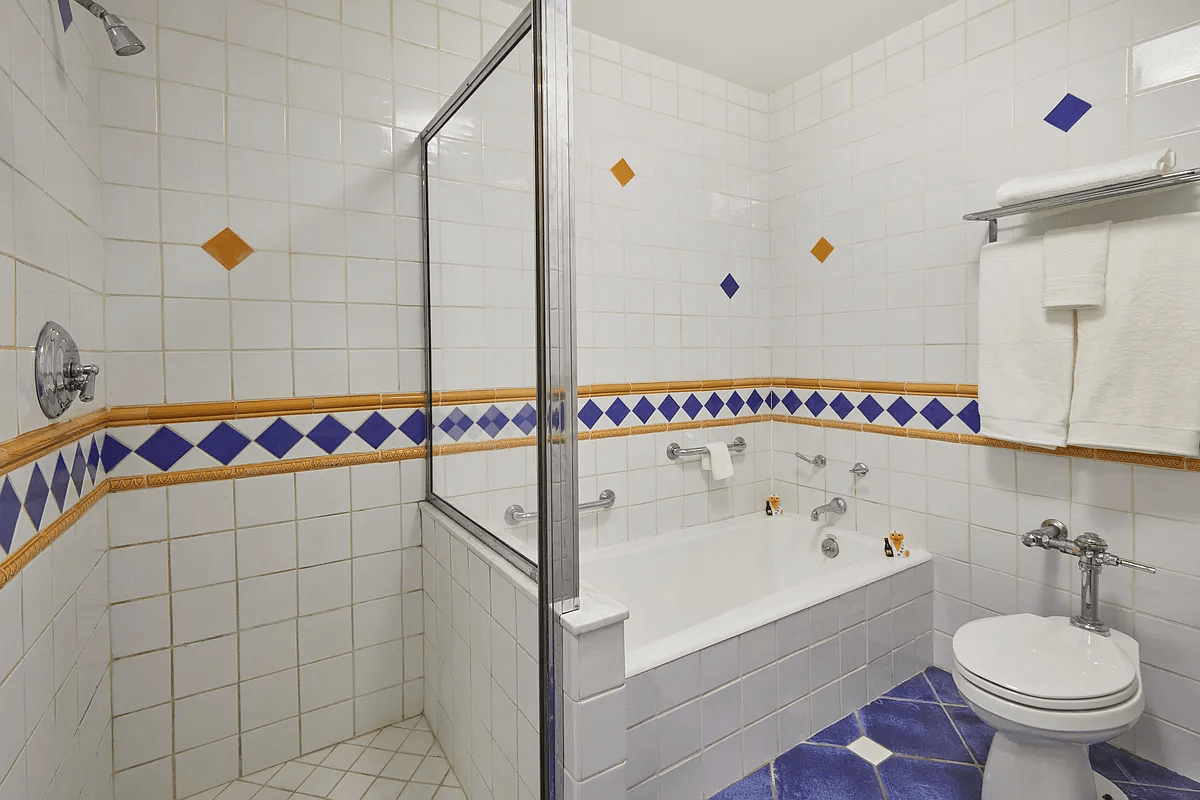 bathroom with white and blue tile