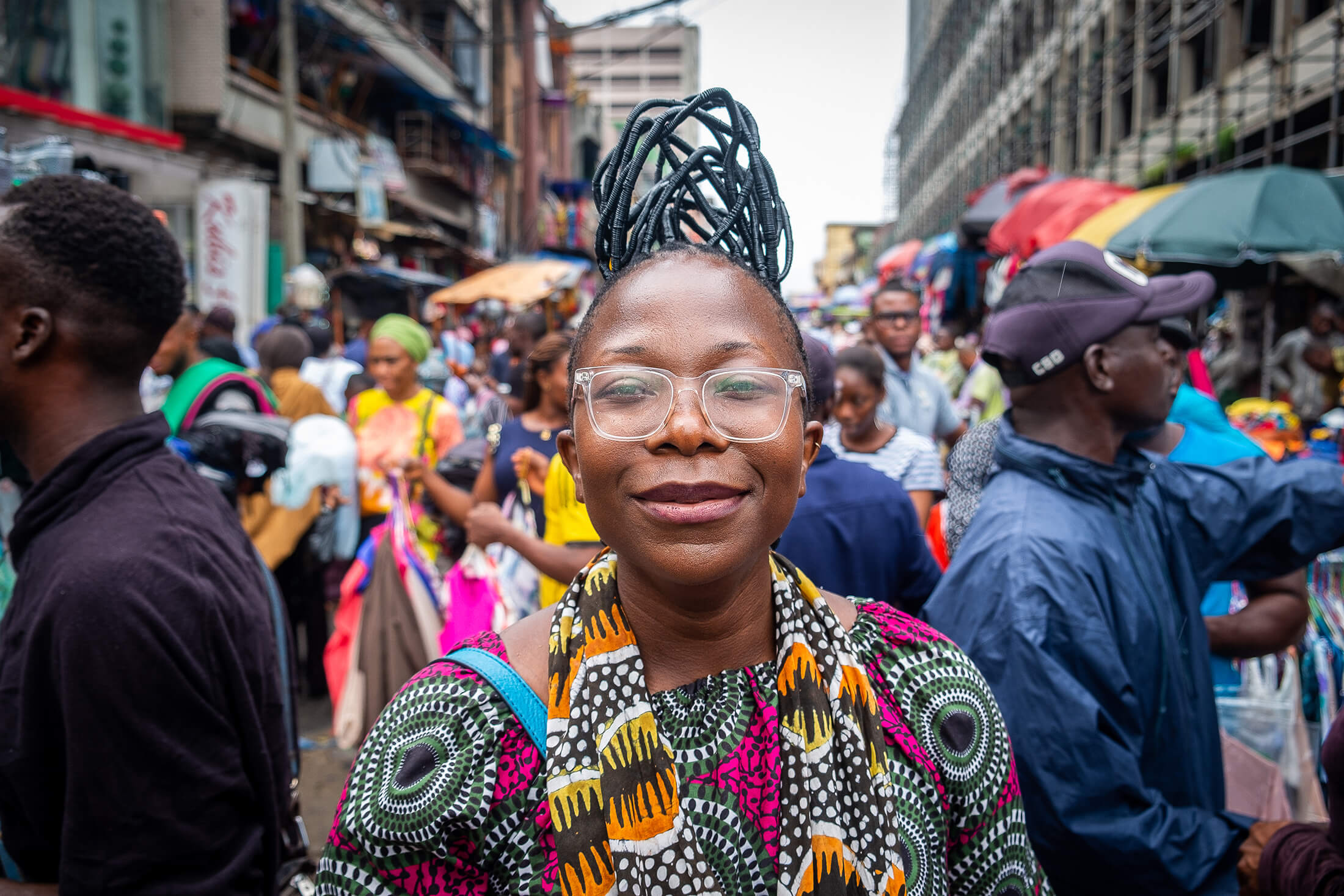 Busayo Olupona walking in a market