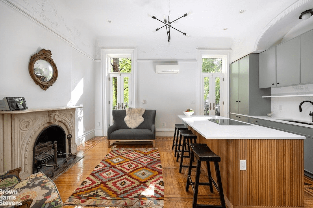 marble mantel in kitchen with French doors out to garden