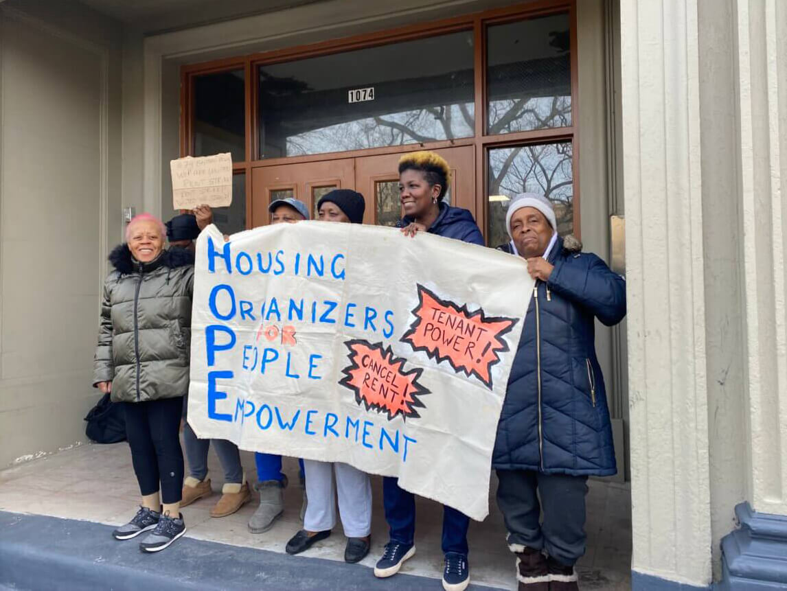 tenants standing outside of the building