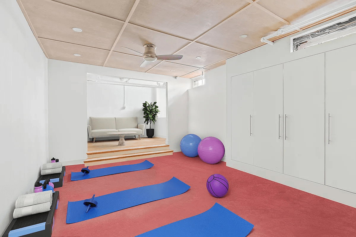 workout area set up in basement