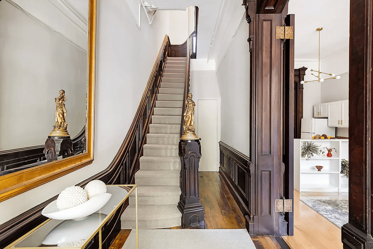 entry with sculpture on stair