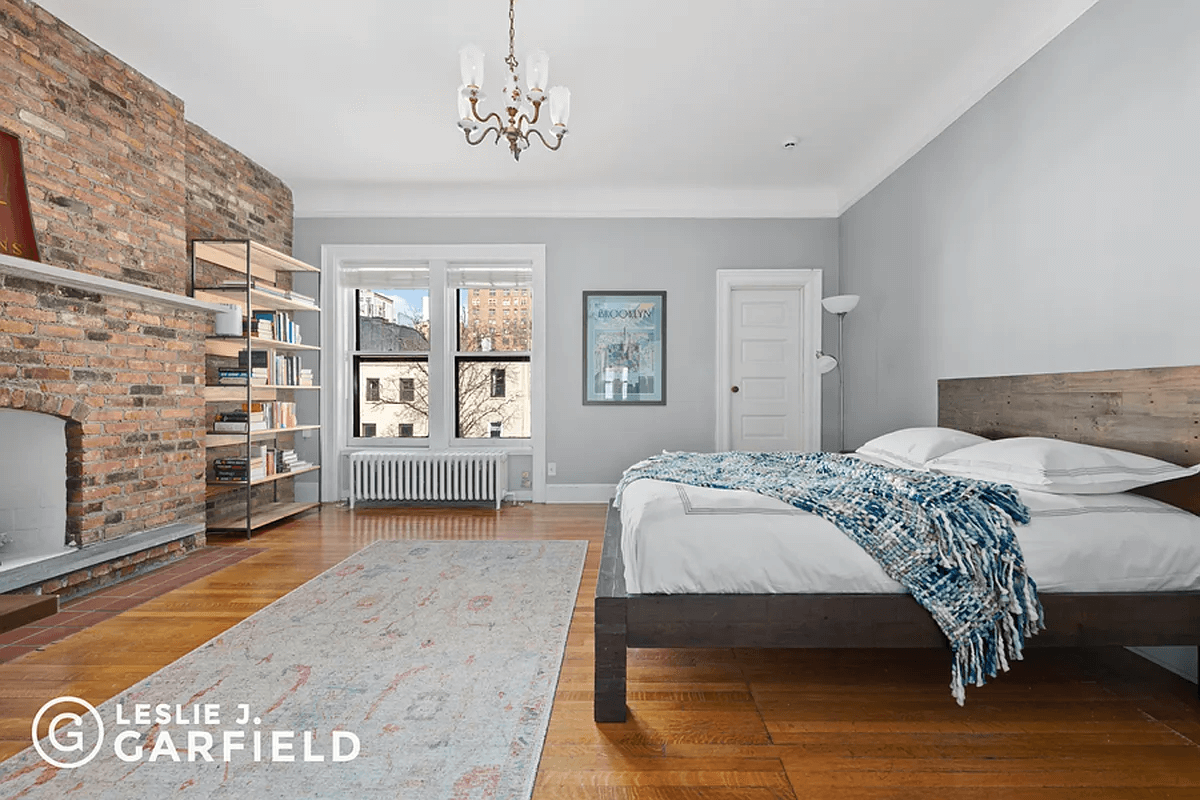 bedroom with exposed brick
