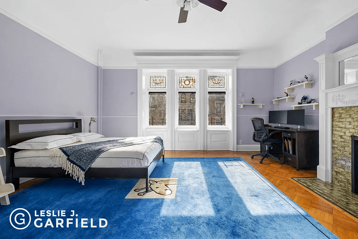 bedroom with stained glass and mantel