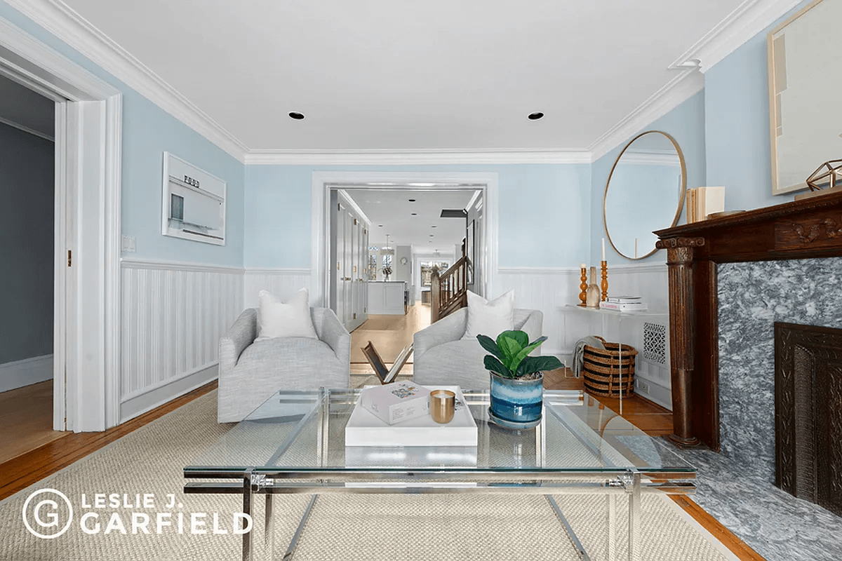 garden level front room with wainscoting and mantel