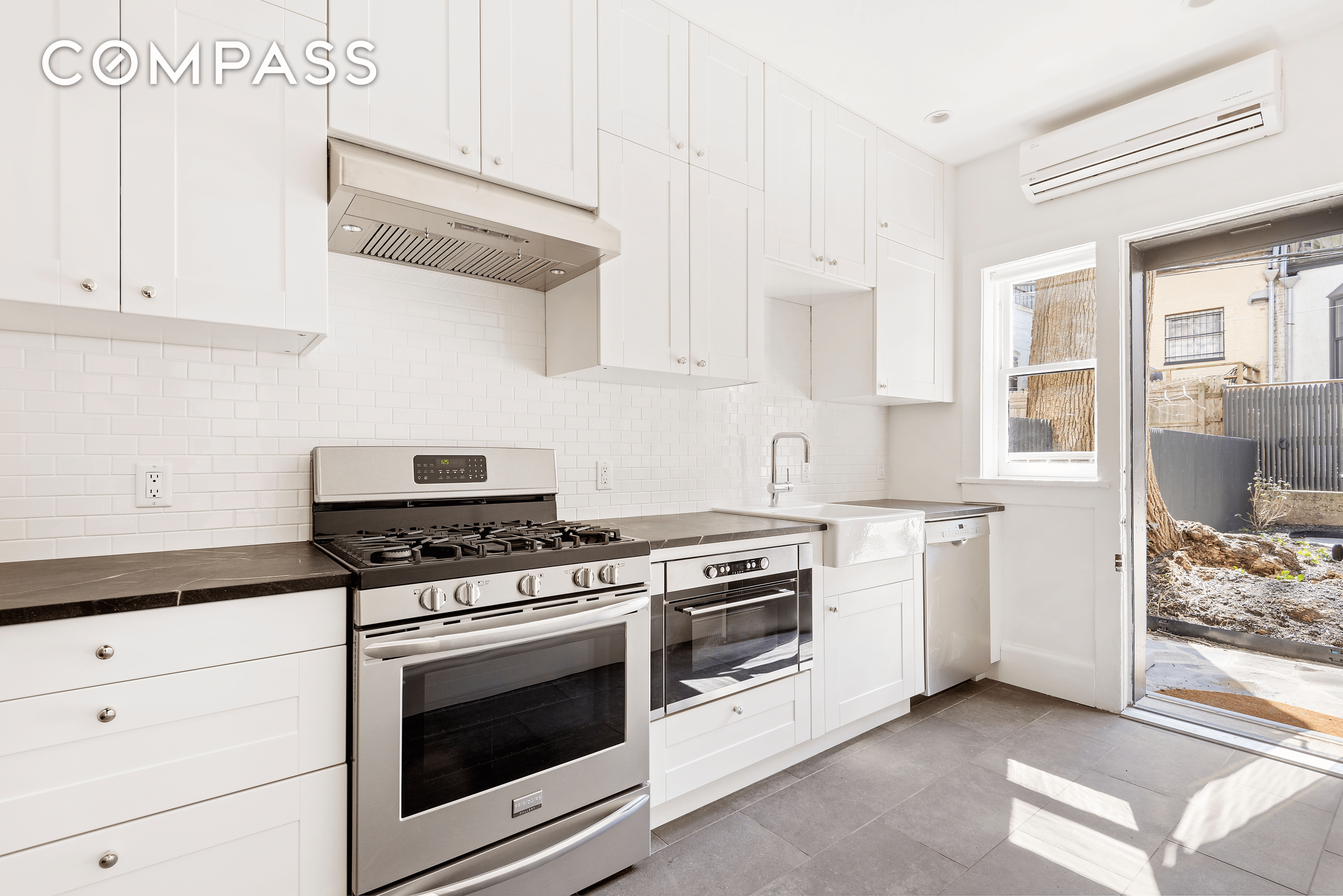 kitchen with white cabinets and tile floor