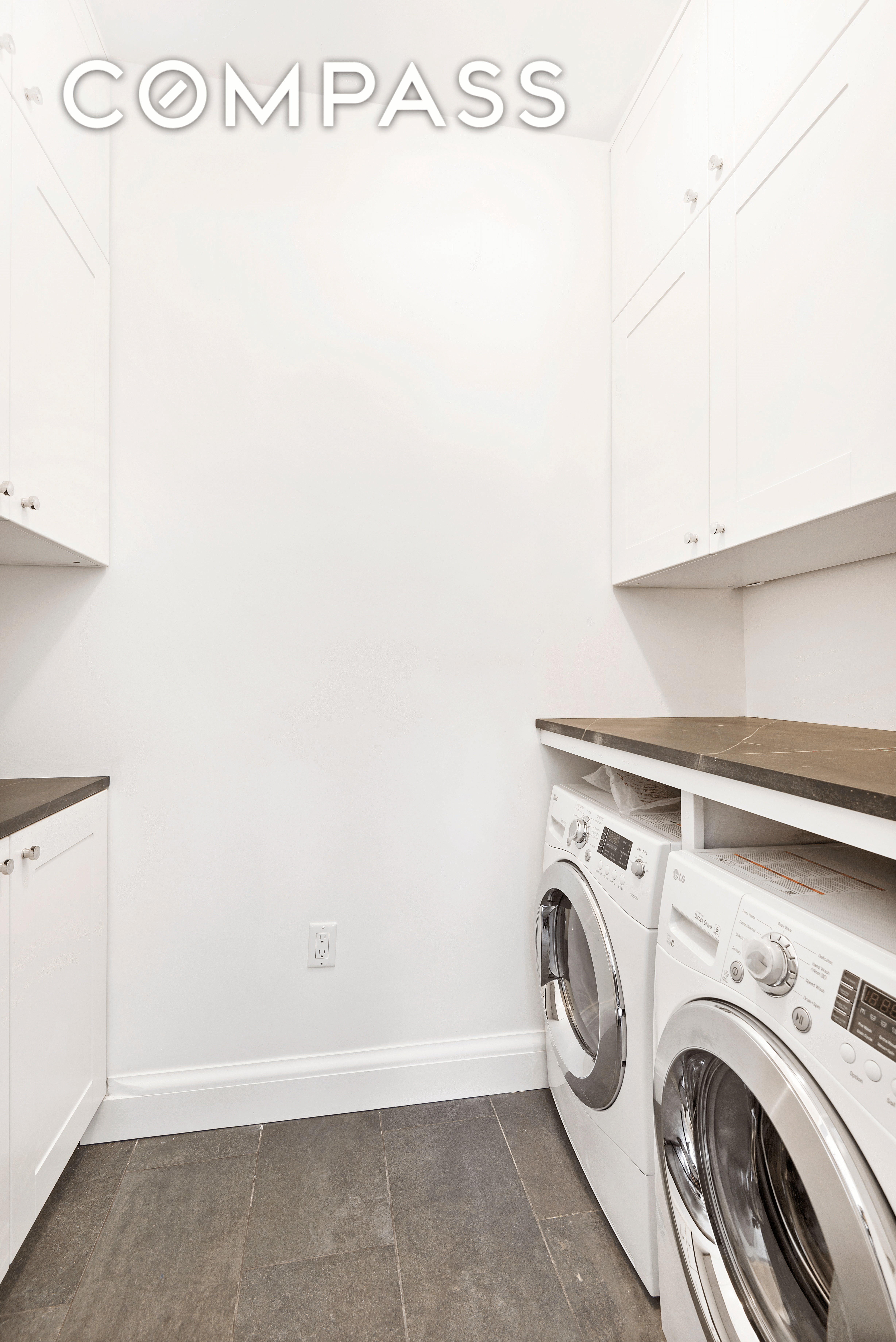 laundry with cabinets