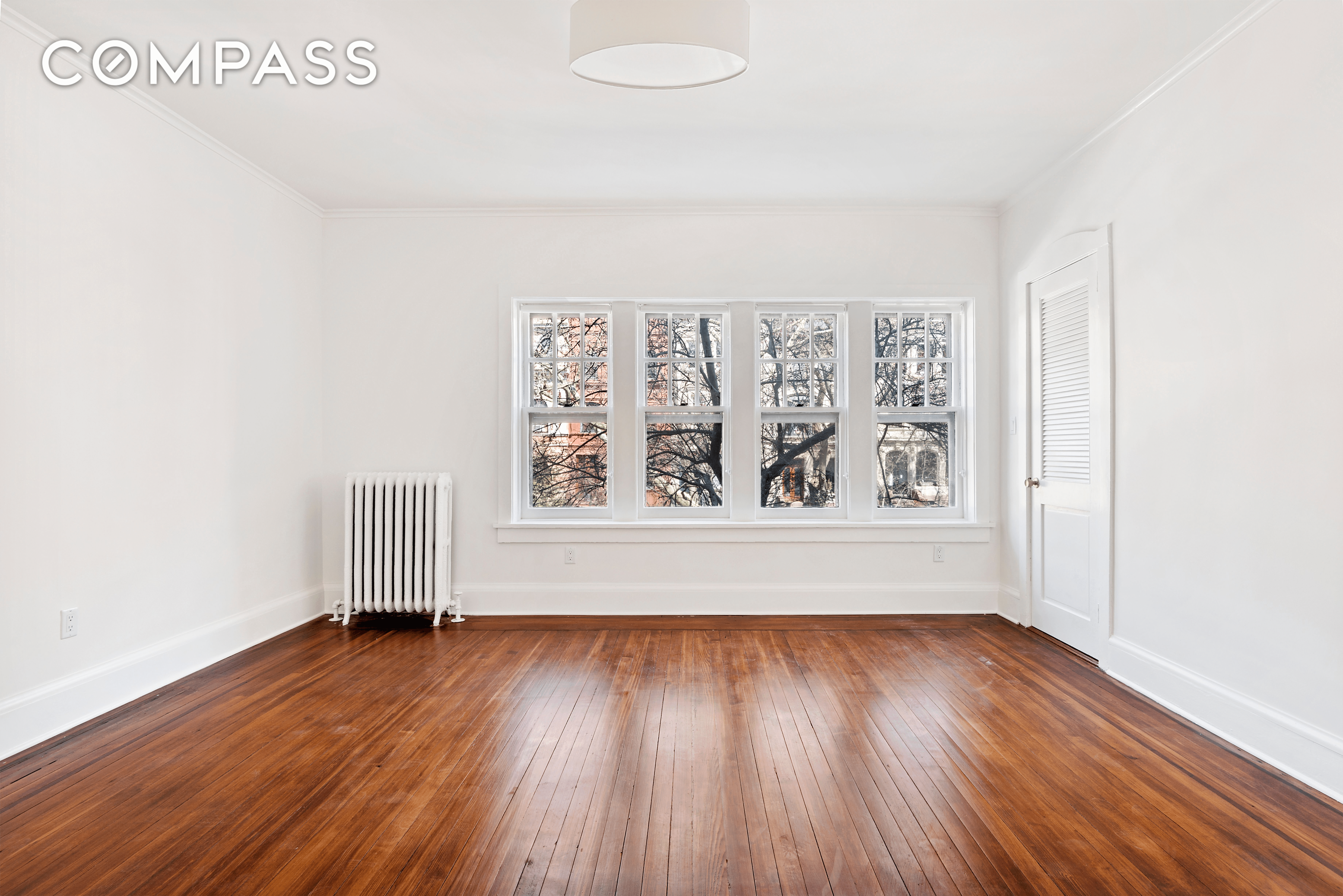 bedroom with wood floor and ceiling fixture