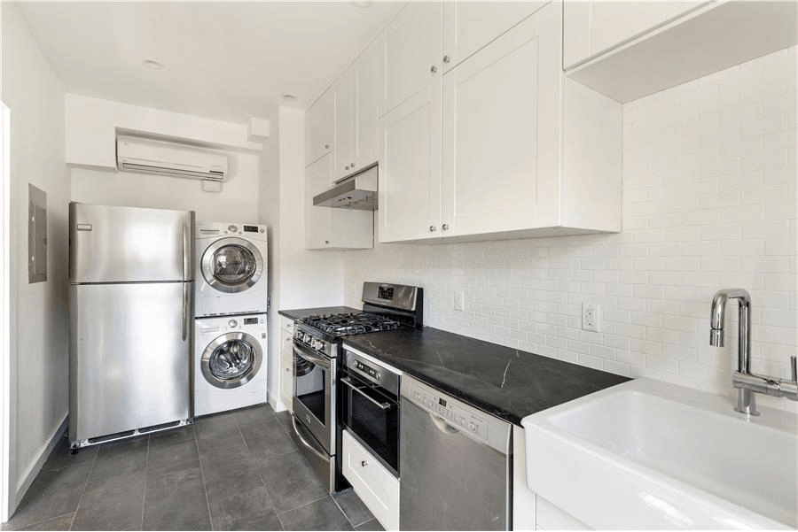 kitchen with white cabinets and tile floor