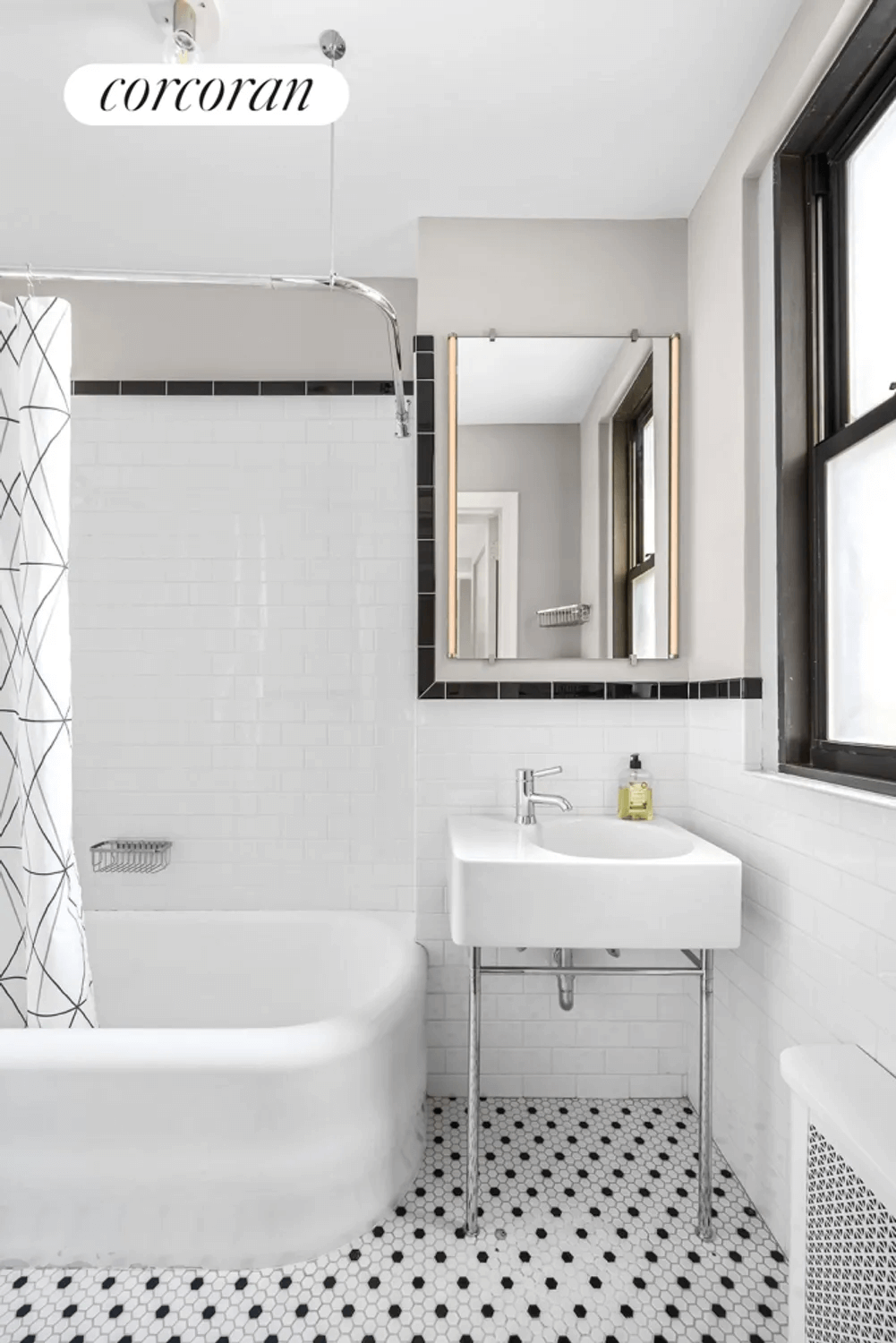 bathroom with white fixtures and subway tile