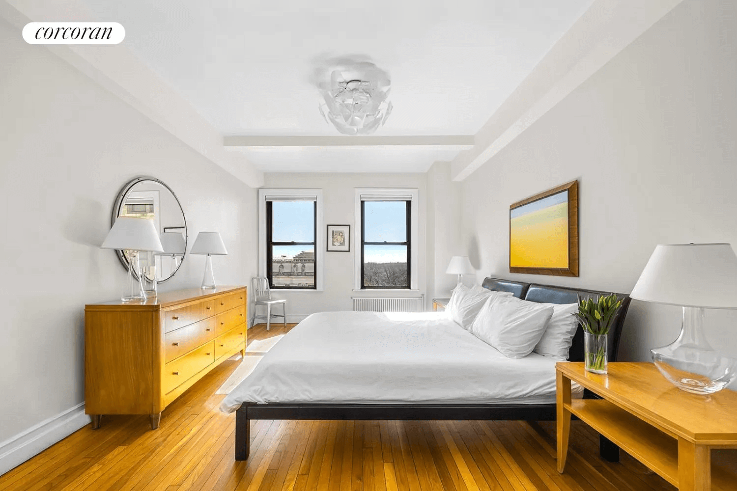 bedroom with wood floor and view of brooklyn museum