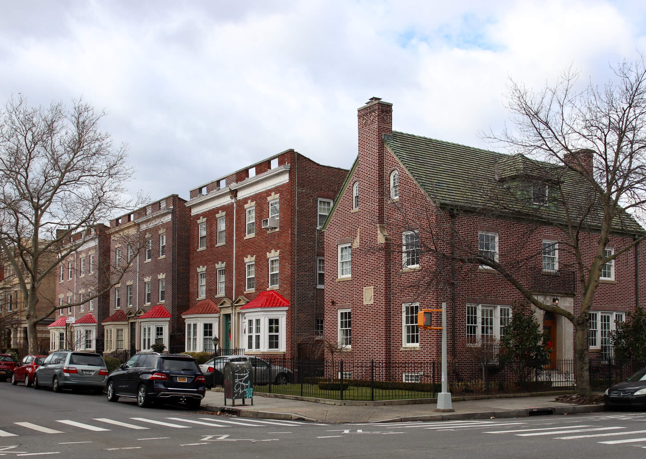 a street view with brick houses