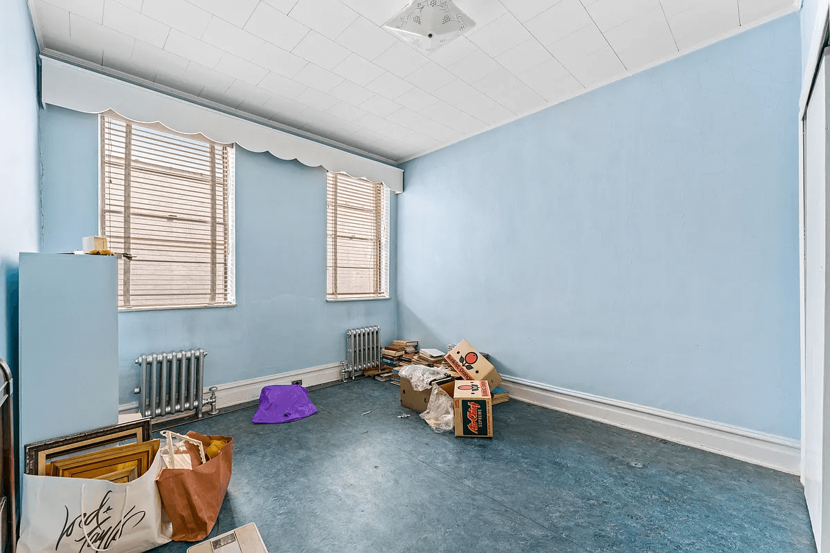 bedroom with blue linoleum floor