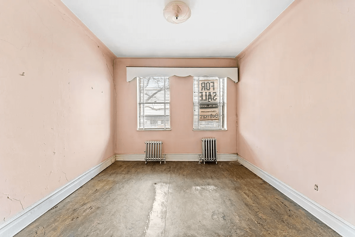 bedroom with linoleum and pink walls