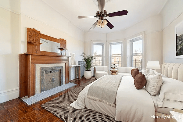 staged bedroom with mantel with display shelves