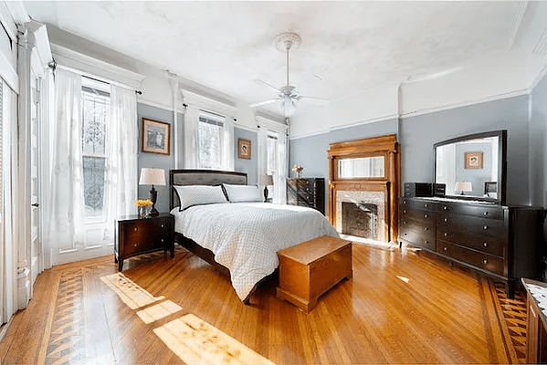 bedroom with wood floors with inlaid borders