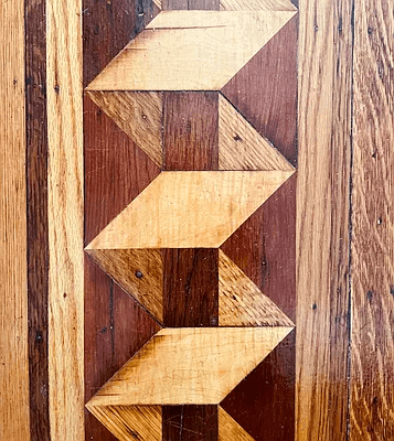 detail of wood floor with inlaid border
