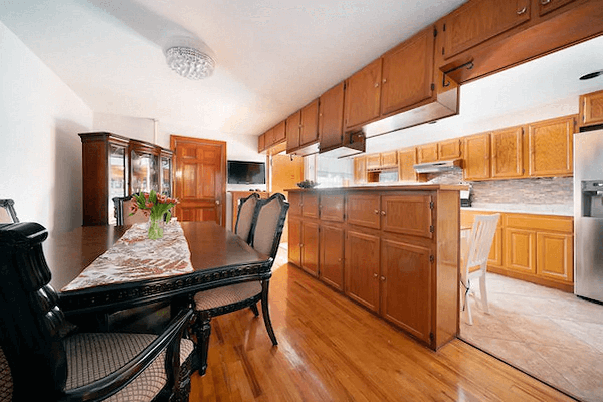 kitchen with wood cabinets, tile floor and dining area