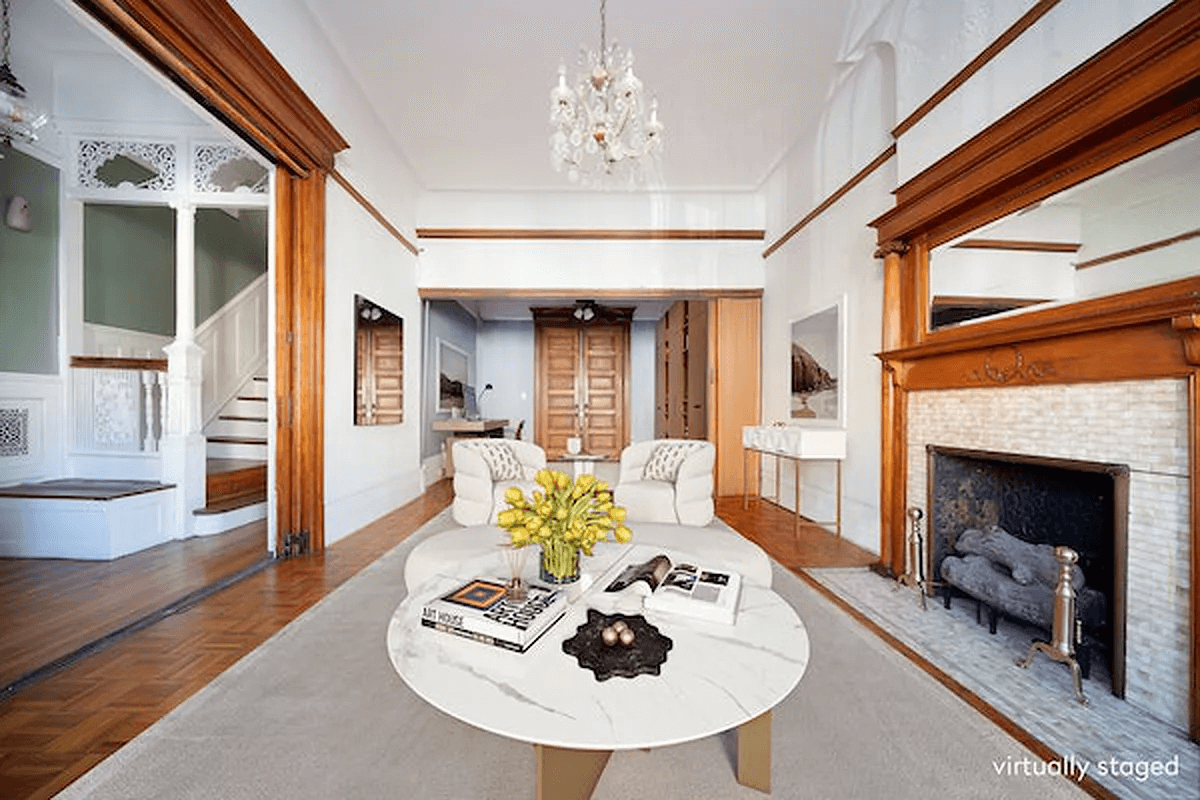 staged parlor with mantel with original tile surround