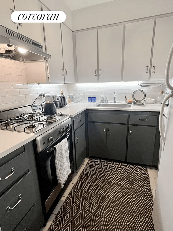 kitchen with dark lower cabinets