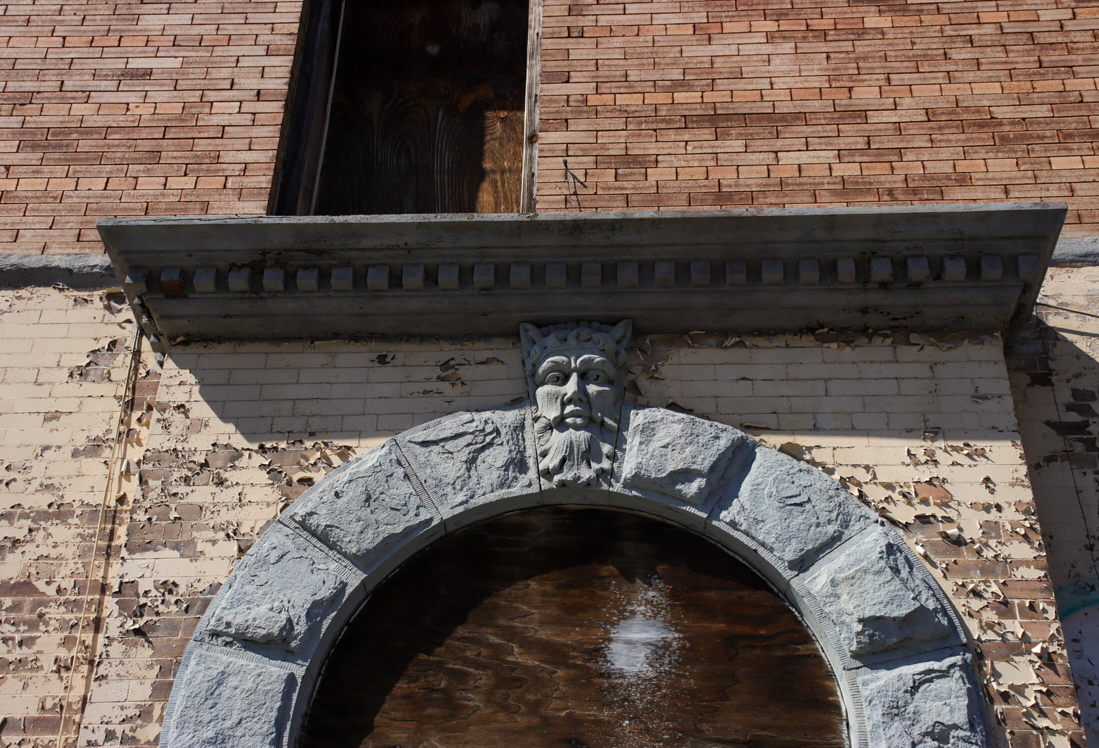 lintel with a face carving