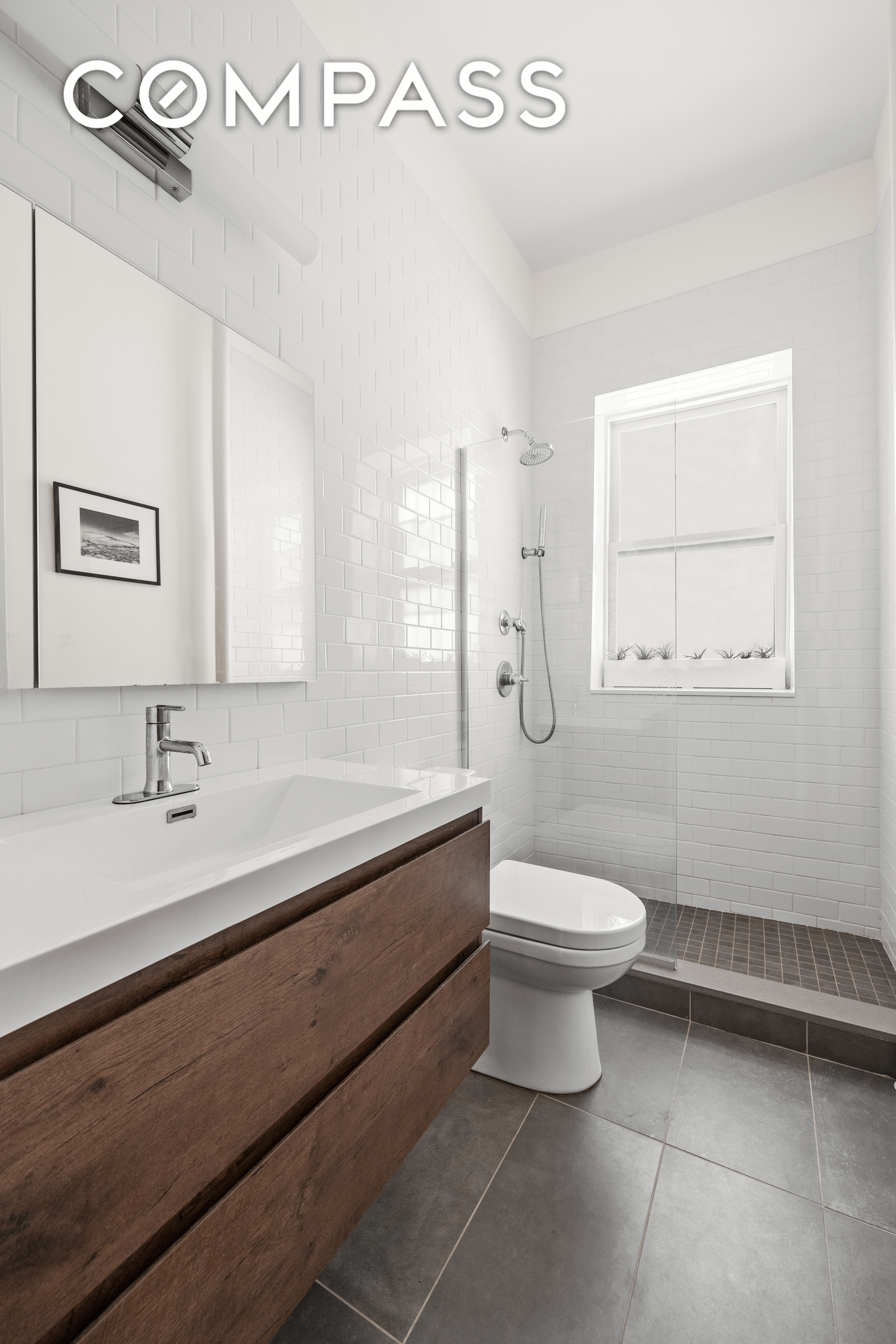 bathroom with wood vanity
