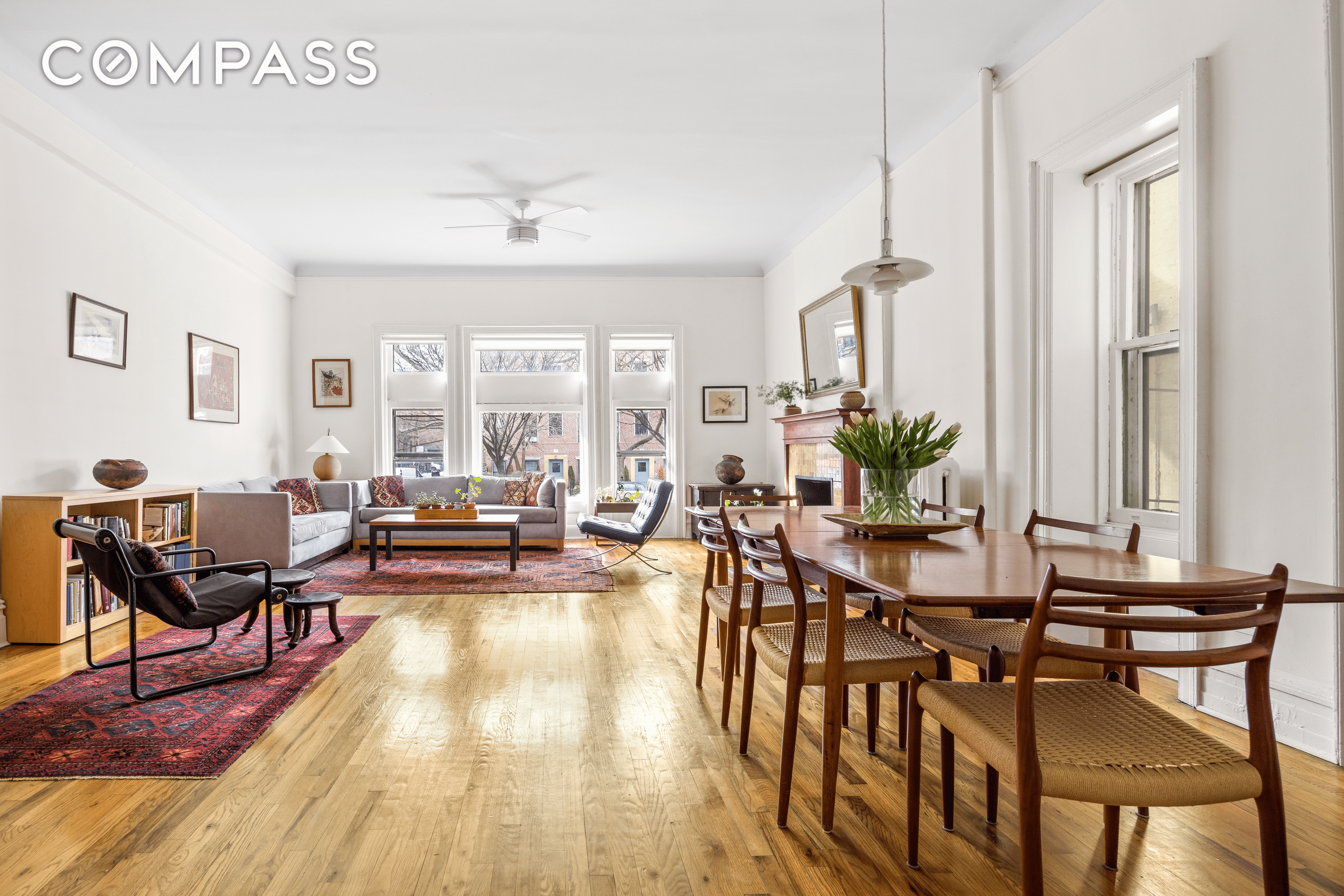 living room and dining area with wood floors