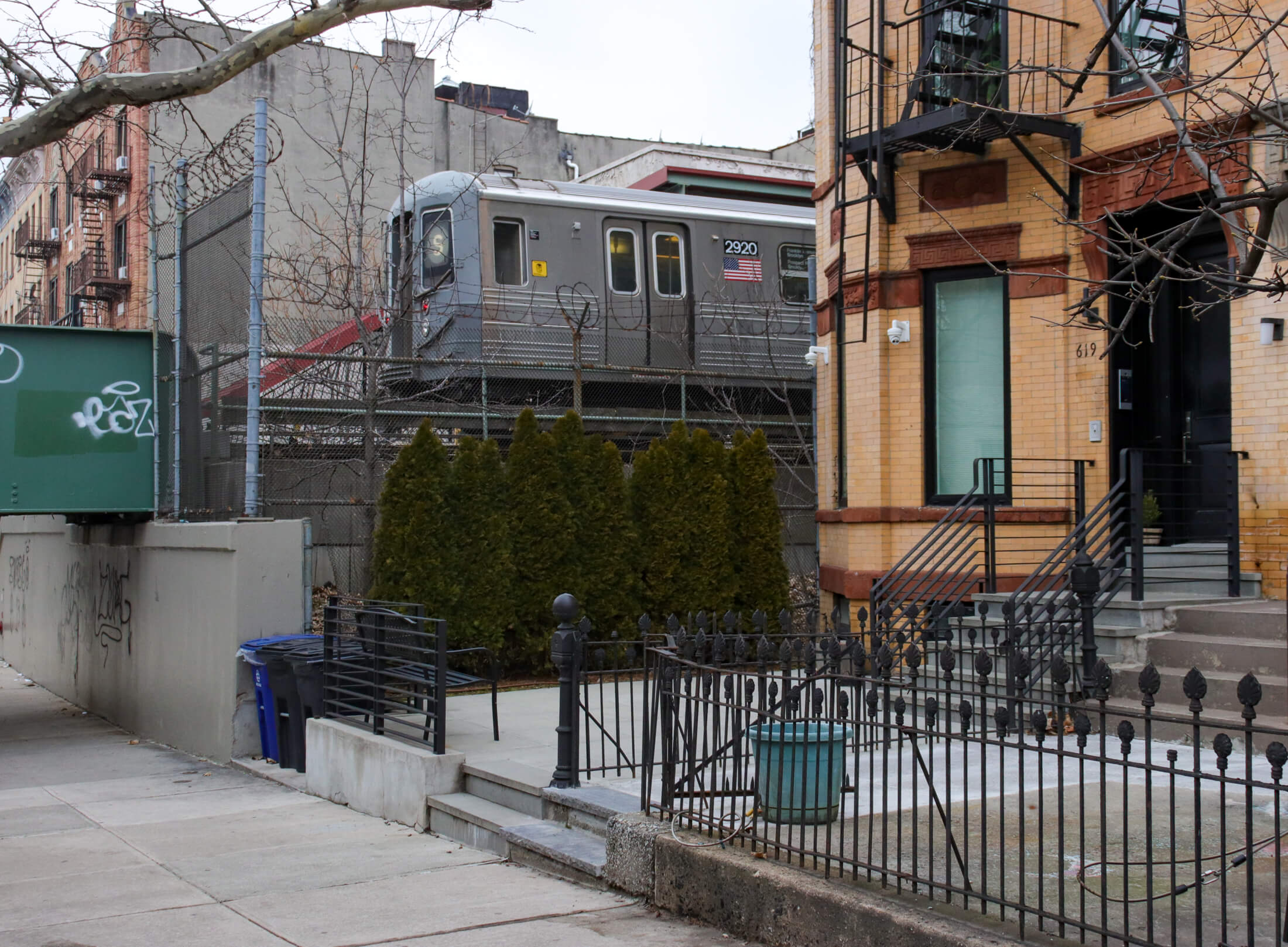 shuttle train going past a building