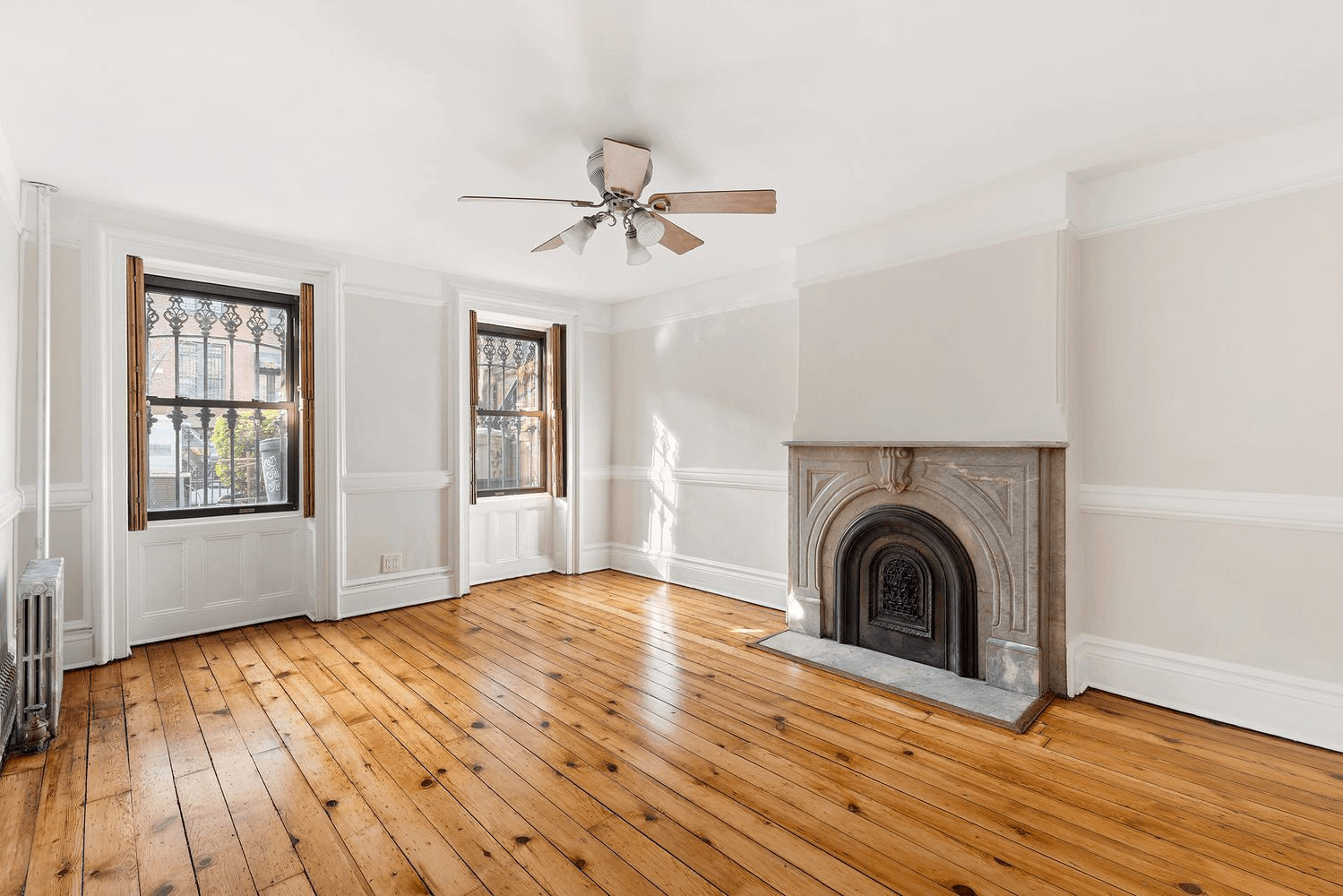 living room with mantel and wood floors