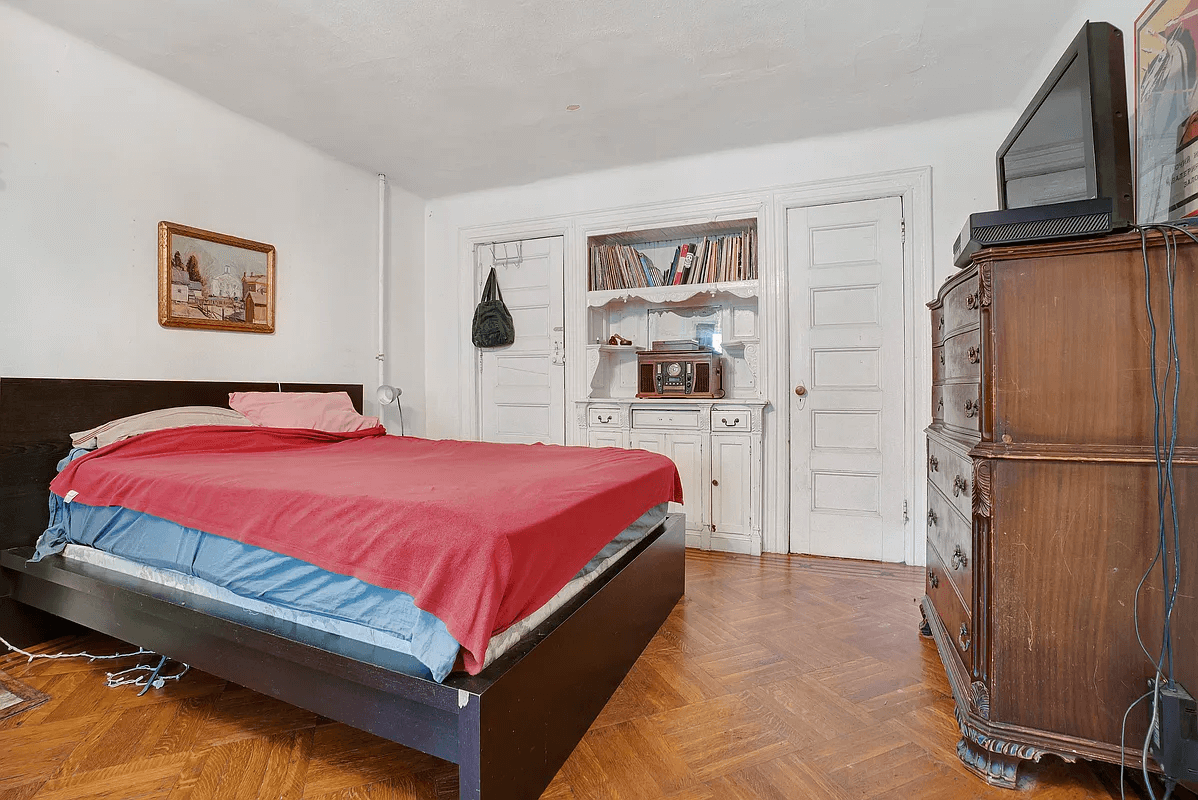 bedroom in original dining room with built-ins