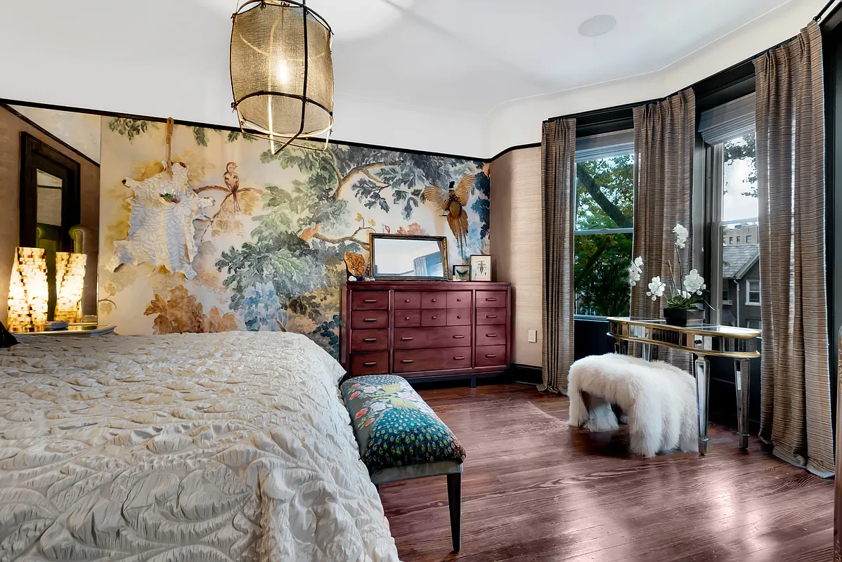 bedroom with bay window and wallpaper