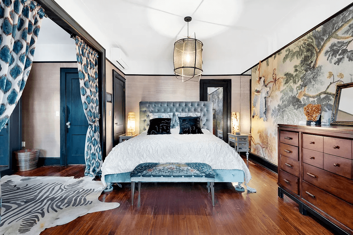 bedroom with scenic wallpaper