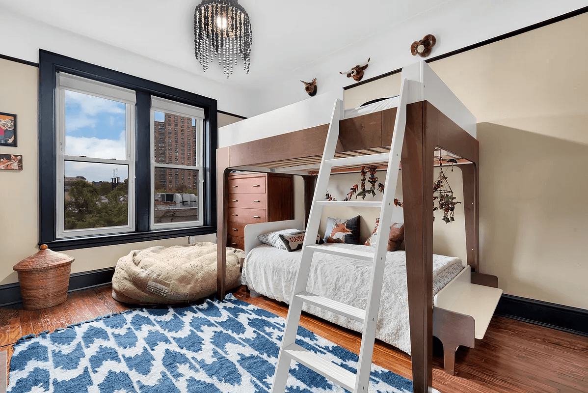 bedroom with wood floors and picture rail