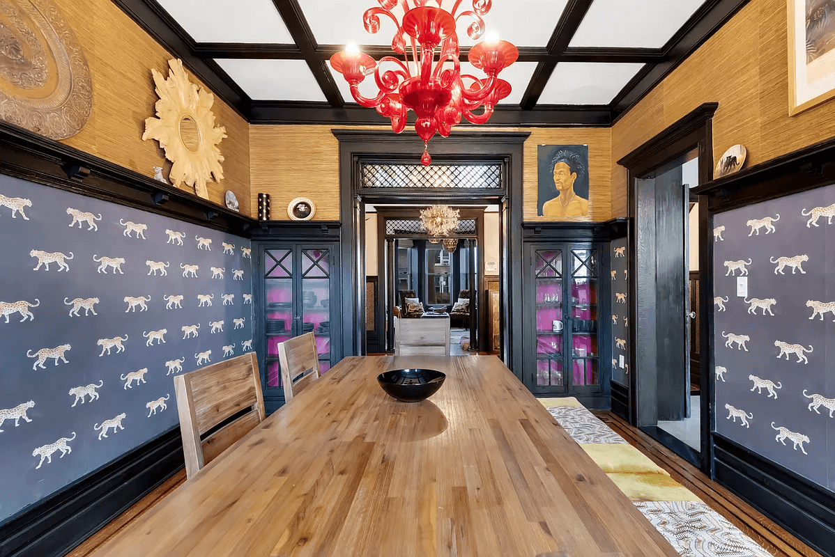 dining room with wallpaper and built ins