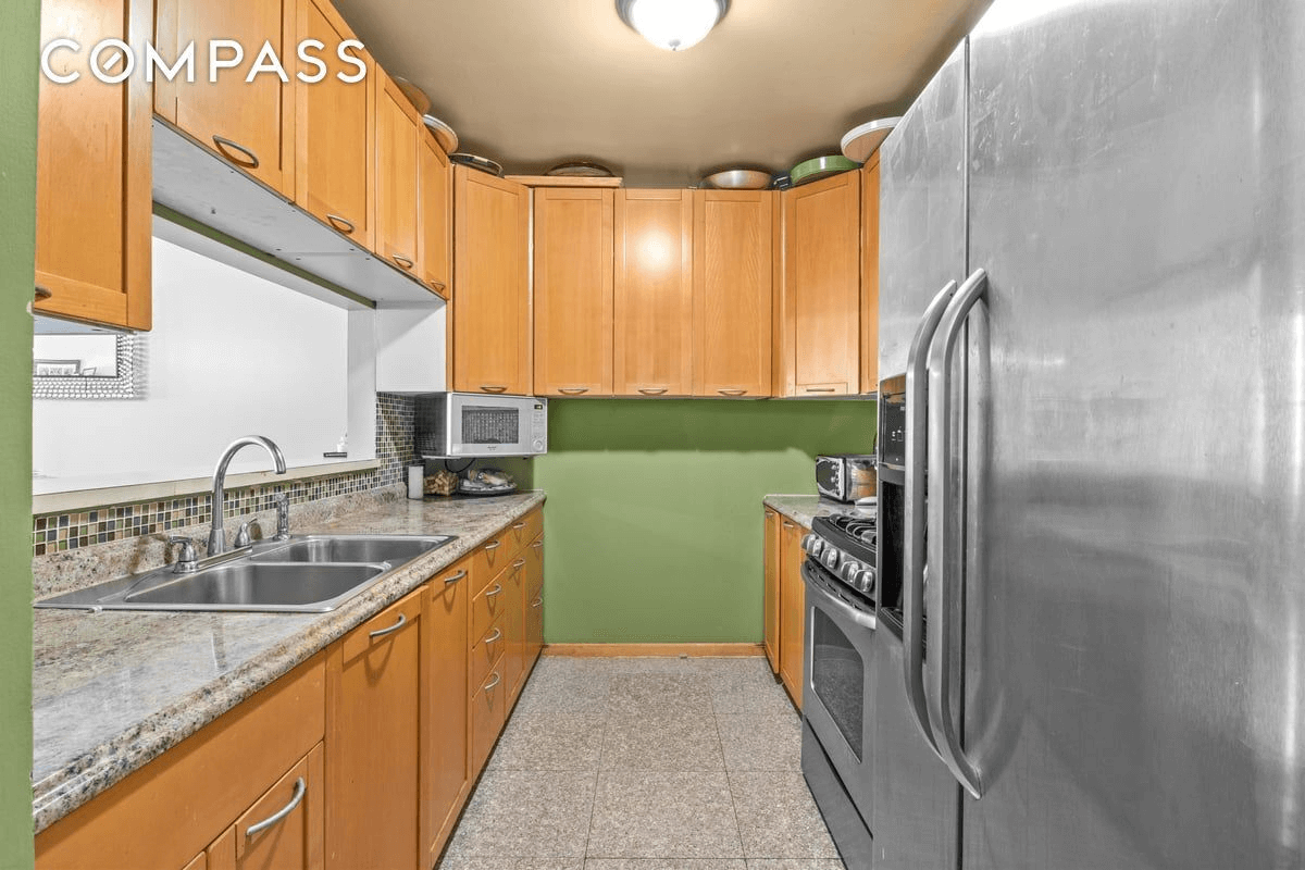 kitchen with tile floor and wood cabinets