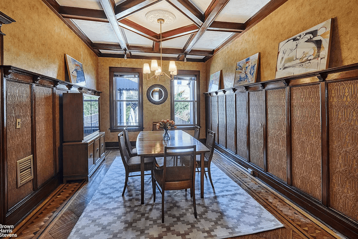 dining room with plate shelf and coffered ceiling