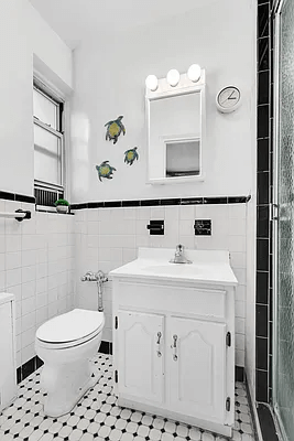 bathroom with black and white tiles