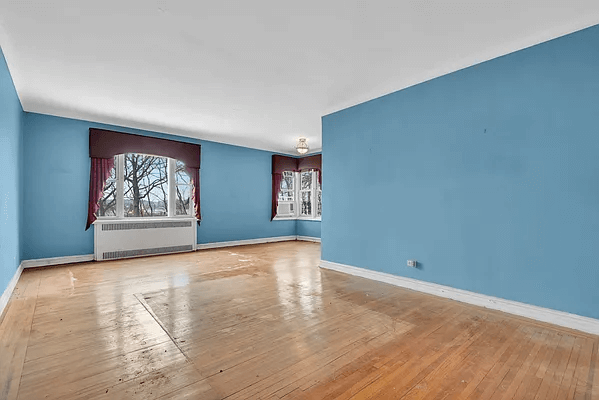 living room and dining area with wood floors