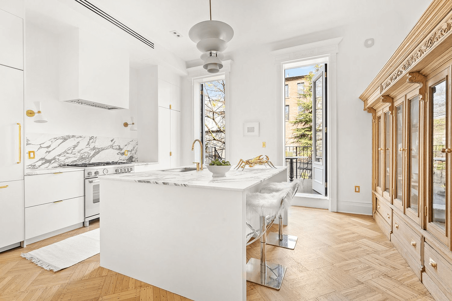 kitchen with white cabinets and large island